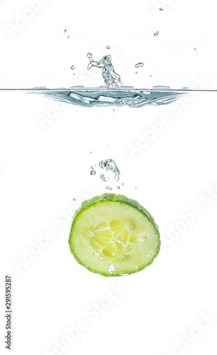 Fresh sliced cucumber in water isolated on white background. One slice