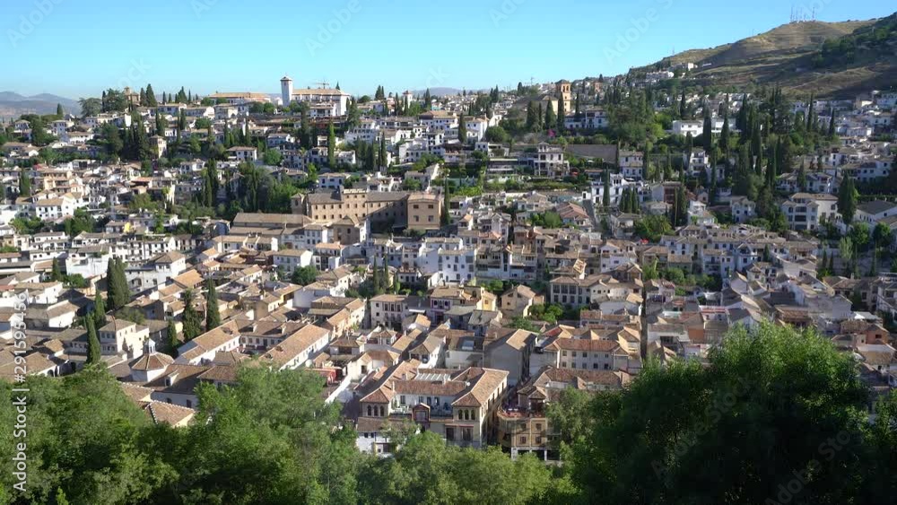 The picturesque Albaicin district in Granada in a sunny summer day. Andalusia, Spain. The picturesque Albaicin district in Granada in a sunny summer day. Andalusia, Spain.