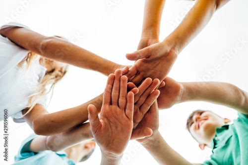 Group of children with their hands together