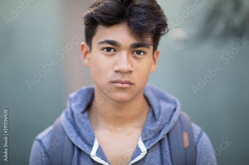 Portrait of a handsome Asian young man next to the blurred background