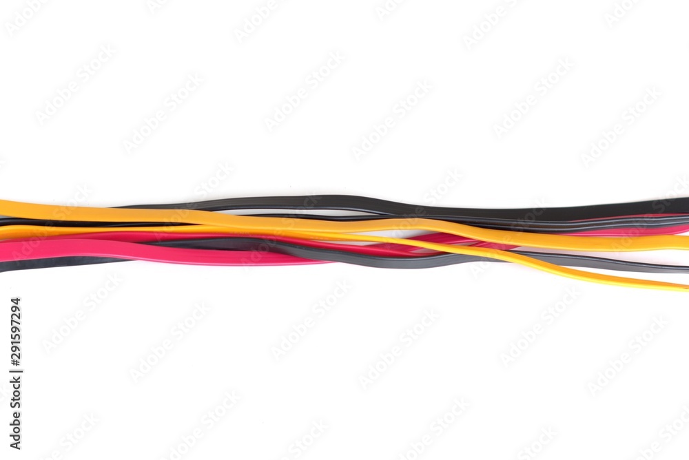 Red, black and yellow cables tangled across a white background. Network infrastructure, tech support abstract concept. Red, black and yellow cables tangled across a white background. Network infrastructure, tech support abstract concept.