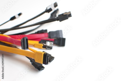 Red, black and yellow computer data cables. Data storage, network server infrastructure concept. Plenty of negative space.
