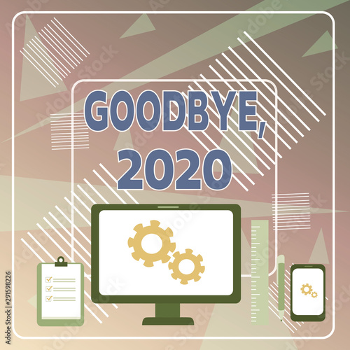 Word writing text Goodbye 2020. Business photo showcasing New Year Eve Milestone Last Month Celebration Transition Business Concept PC Monitor Mobile Device Clipboard Ruler Ballpoint Pen photo
