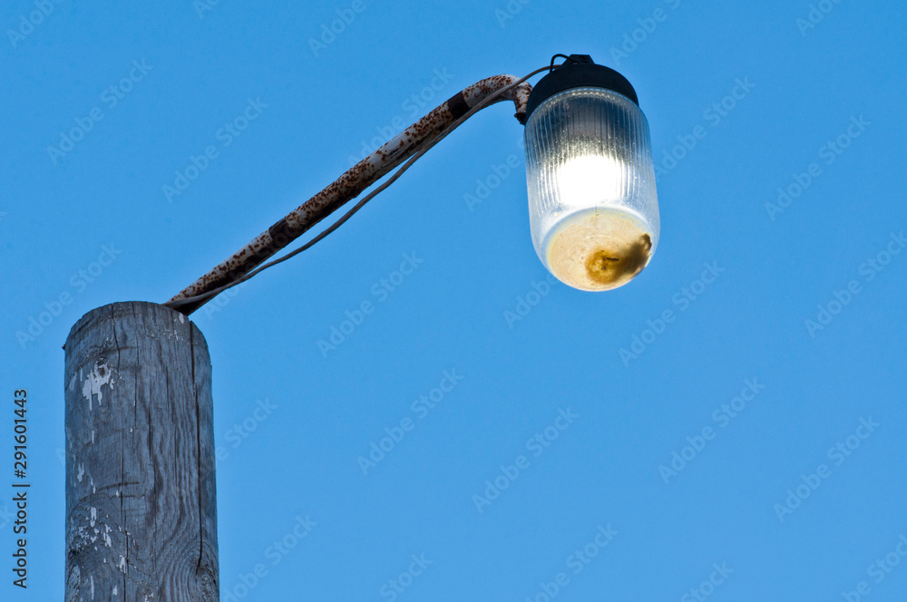 Fototapeta premium Street lantern on the Azov beach on camping territory