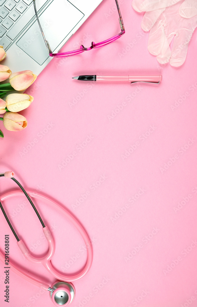 Women's Health Issues concept on pink doctor's desk flat lay overhead vertical with copy space. Women's Health Issues concept on pink doctor's desk flat lay overhead vertical with copy space.