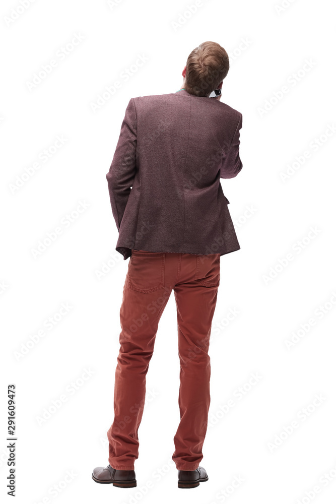 Fototapeta premium rear view. young man with smartphone looking at blank screen