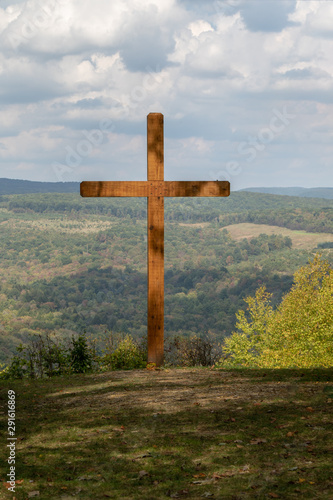 Large wooden cross in the mountain, cross overlooking valley