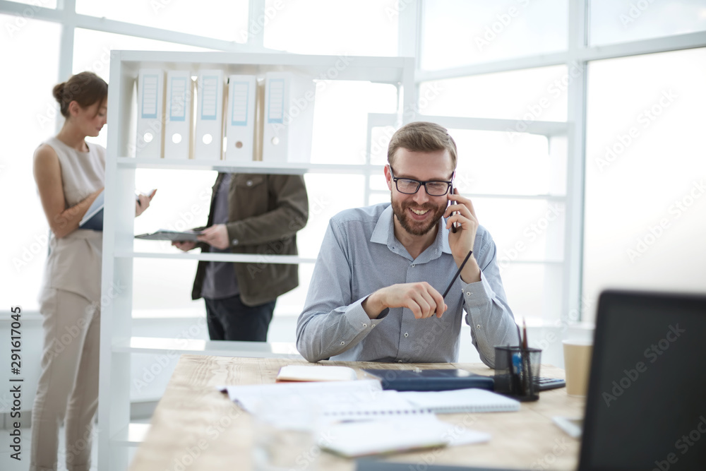 business man talking to a client on a smartphone business man talking to a client on a smartphone