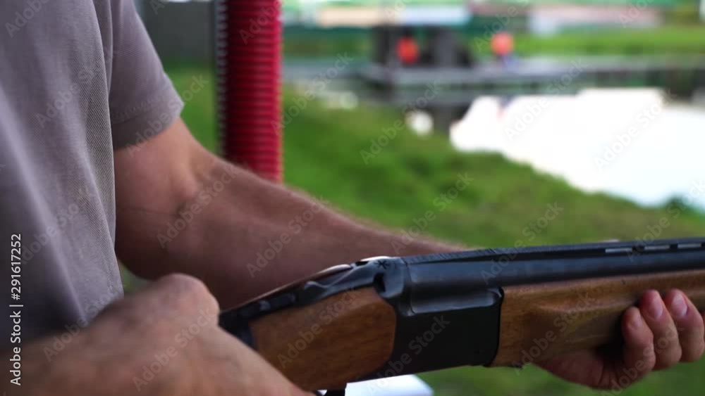 Reload Rifle Cowboy Man is sport club reload hunting rifle with two patron. Close up of ...