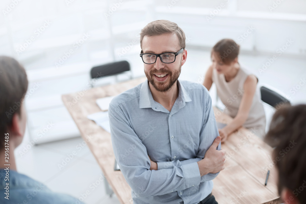 close up.young employee discussing his ideas with colleagues close up.young employee discussing his ideas with colleagues