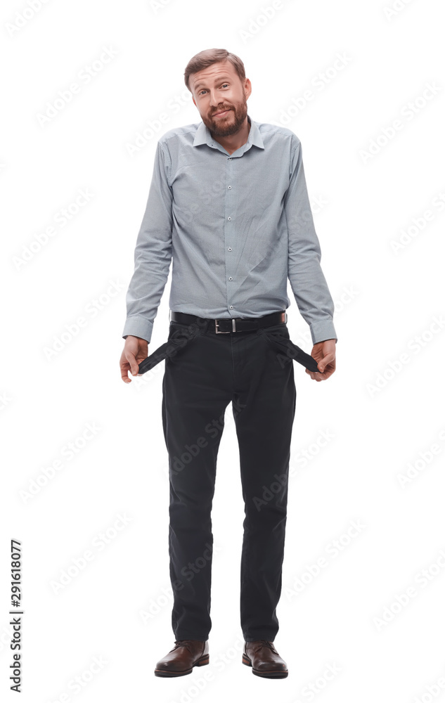 in full growth. businessman showing empty pockets.isolated on white in full growth. businessman showing empty pockets.isolated on white