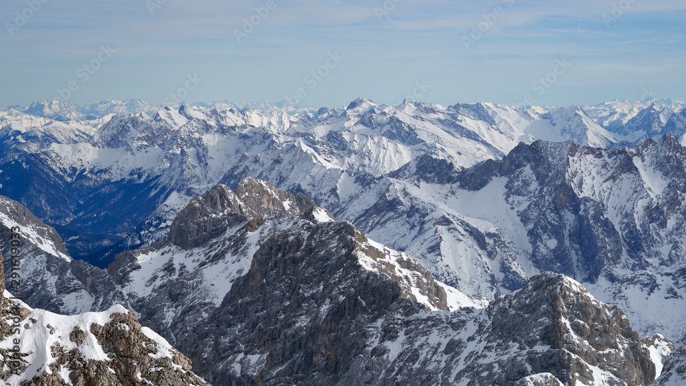 Alpine mountains, panoramic view from the top of the Zugspitze peak, Germany. It lies south of the town of Garmisch-Partenkirchen.                               