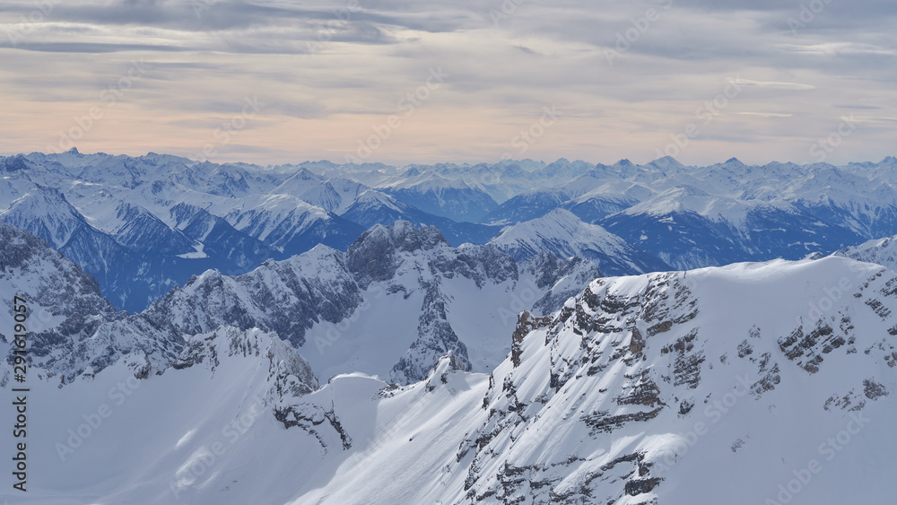 Alpine mountains, panoramic view from the top of the Zugspitze peak, Germany. It lies south of the town of Garmisch-Partenkirchen.                               