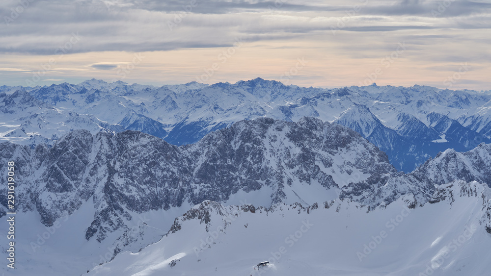 Alpine mountains, panoramic view from the top of the Zugspitze peak, Germany. It lies south of the town of Garmisch-Partenkirchen.                               