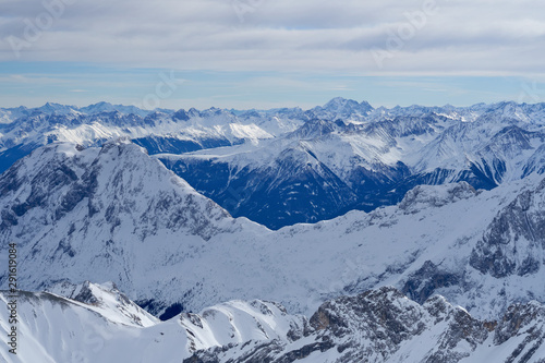Alpine mountains, panoramic view from the top of the Zugspitze peak, Germany. It lies south of the town of Garmisch-Partenkirchen. 