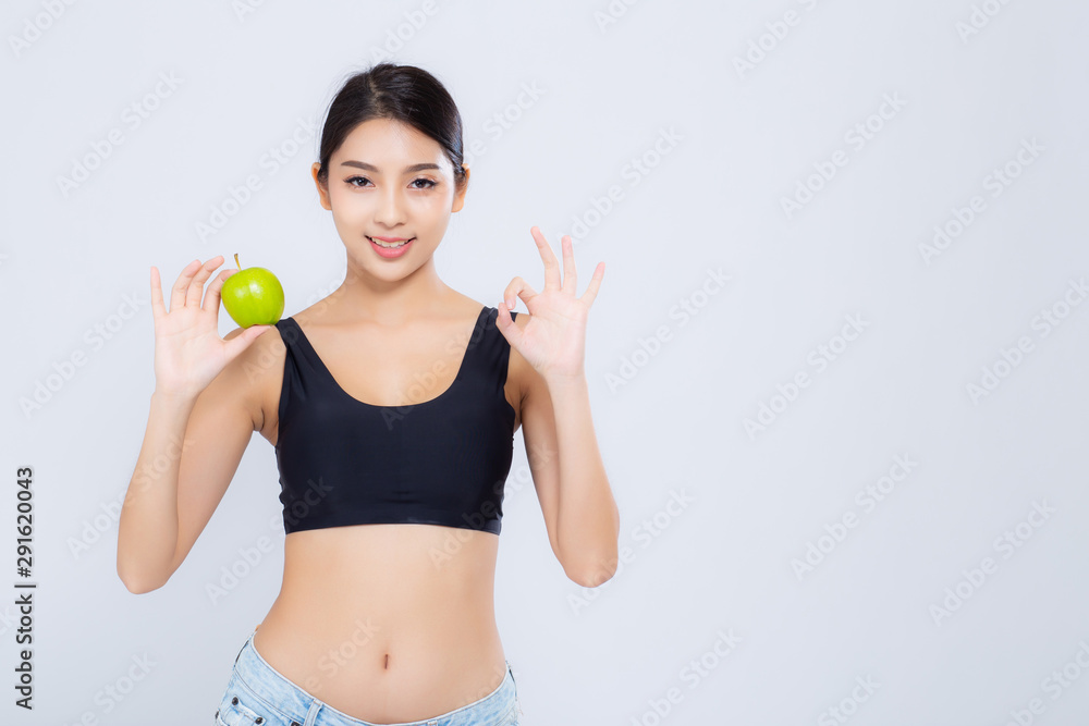 Portrait asian woman smiling holding green apple fruit and beautiful body diet with fit isolated on white background, girl weight slim with cellulite or calories, health and wellness concept. Portrait asian woman smiling holding green apple fruit and beautiful body diet with fit isolated on white background, girl weight slim with cellulite or calories, health and wellness concept.