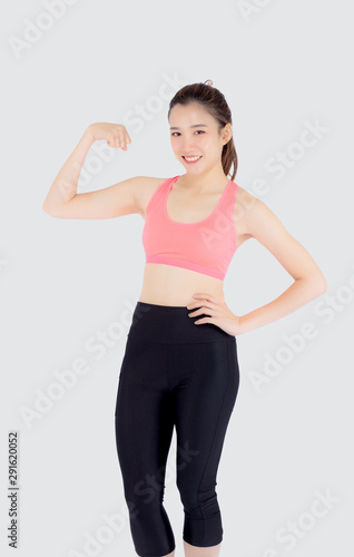 Beautiful young asian woman wear sport clothes have strong and muscle with health, girl show biceps with exercise and workout for wellness isolated on white background, strength and fit concept. © N_studio