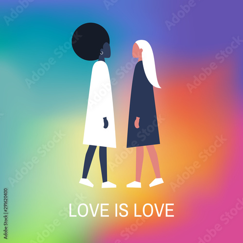 Young lesbian ladies standing in front of each other. Love is love. Interracial romantic relationships. Homosexuality. LGBTQ+