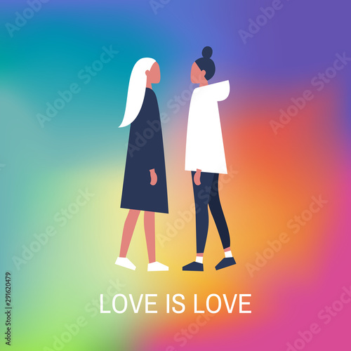 Young lesbian ladies standing in front of each other. Love is love. Romantic relationships. Homosexuality. LGBTQ+