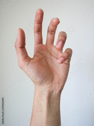 a hand holding something on white background.