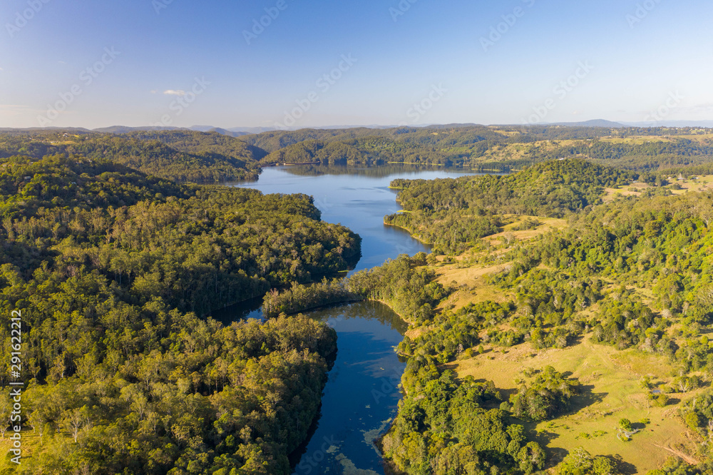Fototapeta Dam, reservoir full of water view from above.