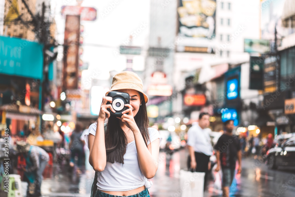 Asian traveler woman with camera at chinatown. Asian traveler woman with camera at chinatown.