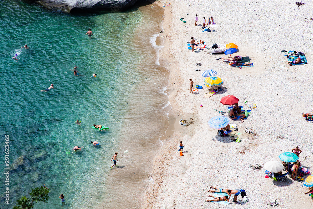 aerial view of people sunbathing on the beach