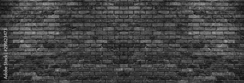 Abstract image of Rustic black grunge brick wall texture background.