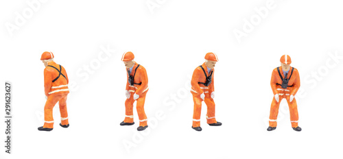 Group of Miniature figurine character as railway shunter standing and posing in posture isolated on white background.