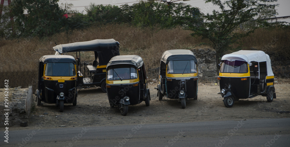 Black and yellow, india Taxi (TukTuk)