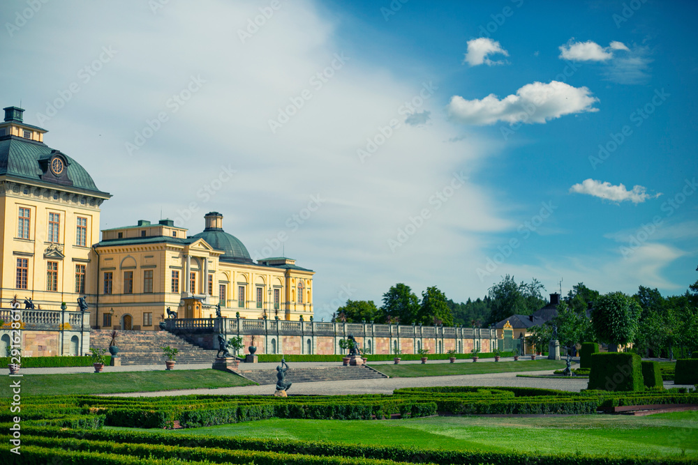 Obraz premium Drottningholm Stockholm, Sweden - Jul 7, 2017: The Drottningholm Royal Palace landscape view from the garden in beautiful sunlight blue sky day.