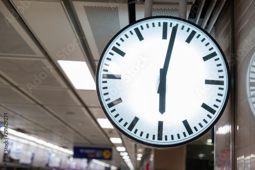 Clock at subway station, analog watch at transportation.