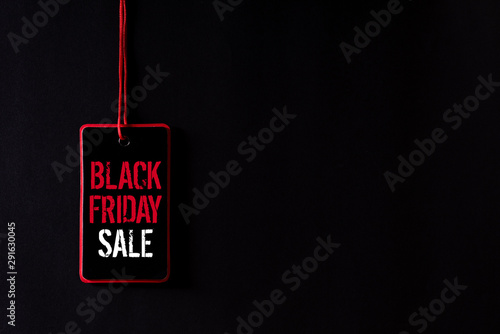 Black Friday Sale text on a red and black tag. Shopping concept. photo