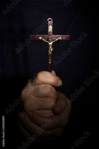Hands with a cross