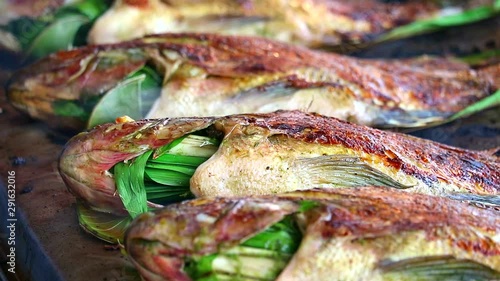 Wallpaper Mural Grilled fish with herbs on stove and smell of good smoke cooking Torontodigital.ca