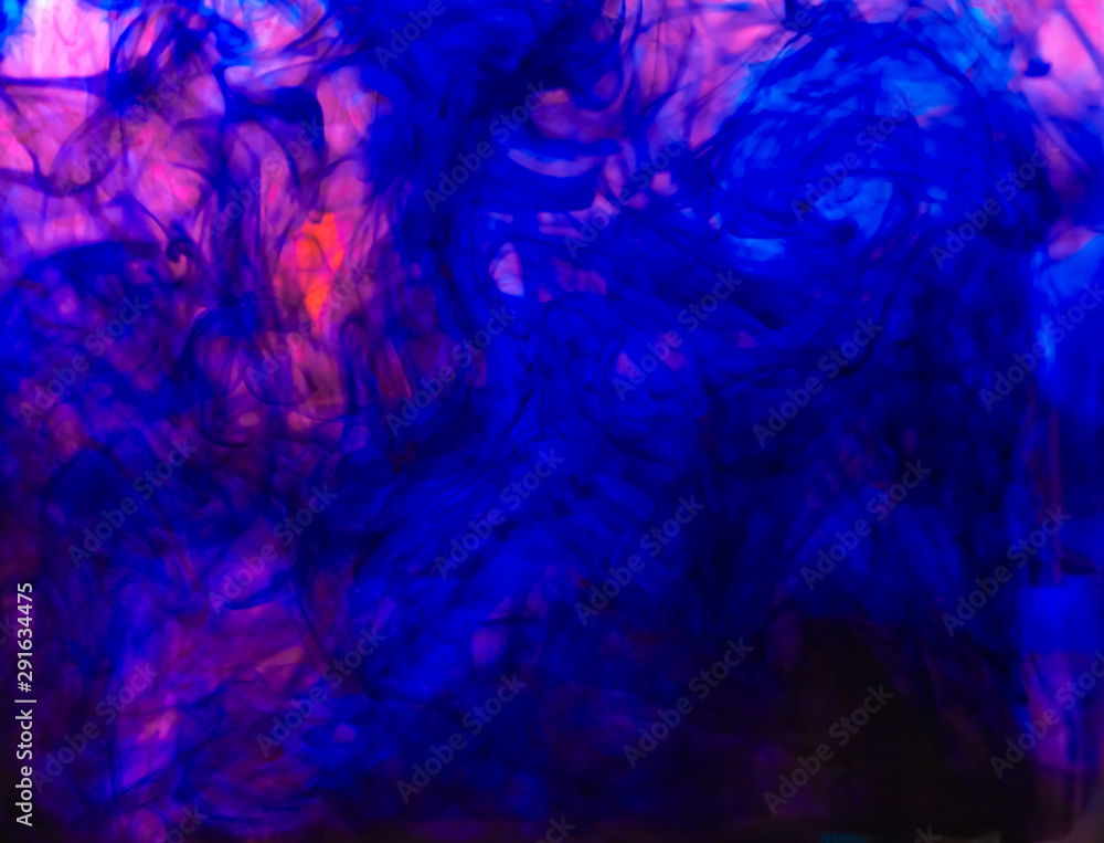 Blurred photo of food color drop and dissolve in water for background and texture concept. Blurred photo of food color drop and dissolve in water for background and texture concept.