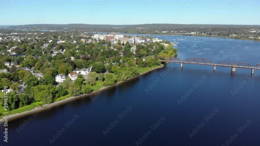 AERIAL: Flying Over The Saint John River Toward Downtown Fredericton. Walking Bridge In The Foreground. AERIAL: Flying Over The Saint John River Toward Downtown Fredericton. Walking Bridge In The Foreground.