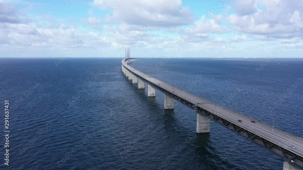Oresund bridge, view over bridge disappearing in the horizon, pull back drone shot Oresund bridge, view over bridge disappearing in the horizon, pull back drone shot