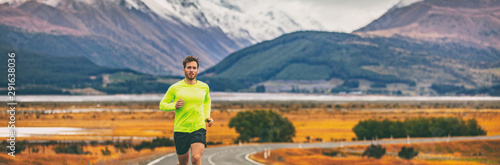 Fotografie Athlete runner running in mountain landscape in panoramic banner background