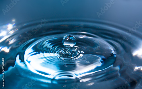 Water splash or drop. Water splash close-up. Blue water drop. Falling water