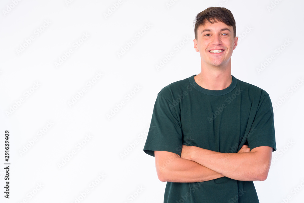 Portrait of happy young handsome man smiling with arms crossed Portrait of happy young handsome man smiling with arms crossed