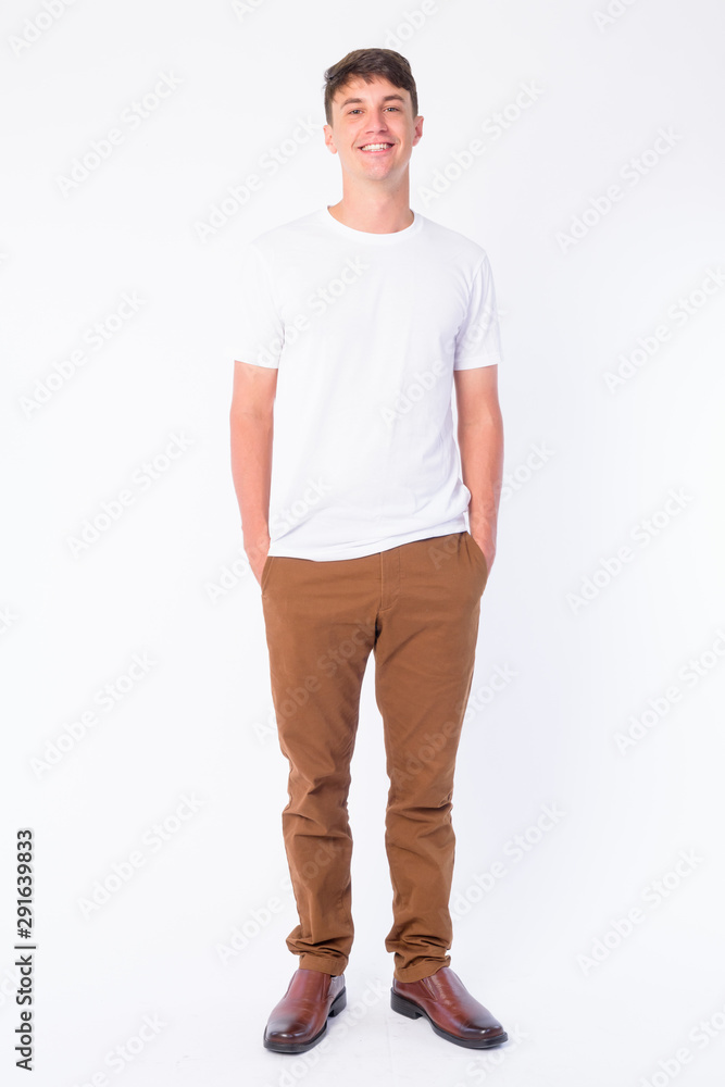 Full body shot of happy young handsome man smiling Full body shot of happy young handsome man smiling