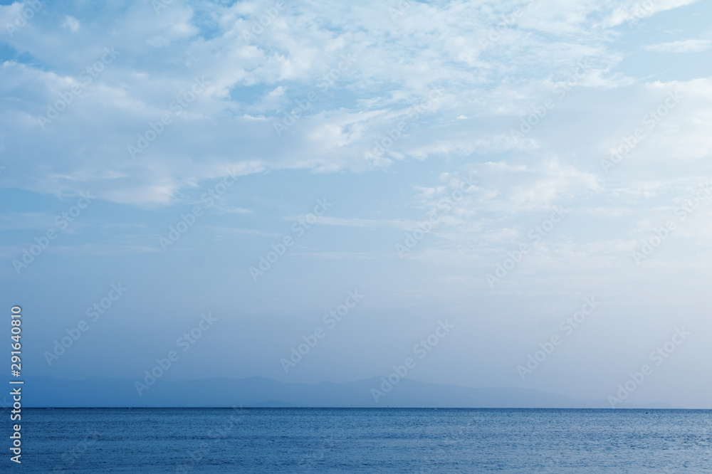 The blue seascape in the summer background.