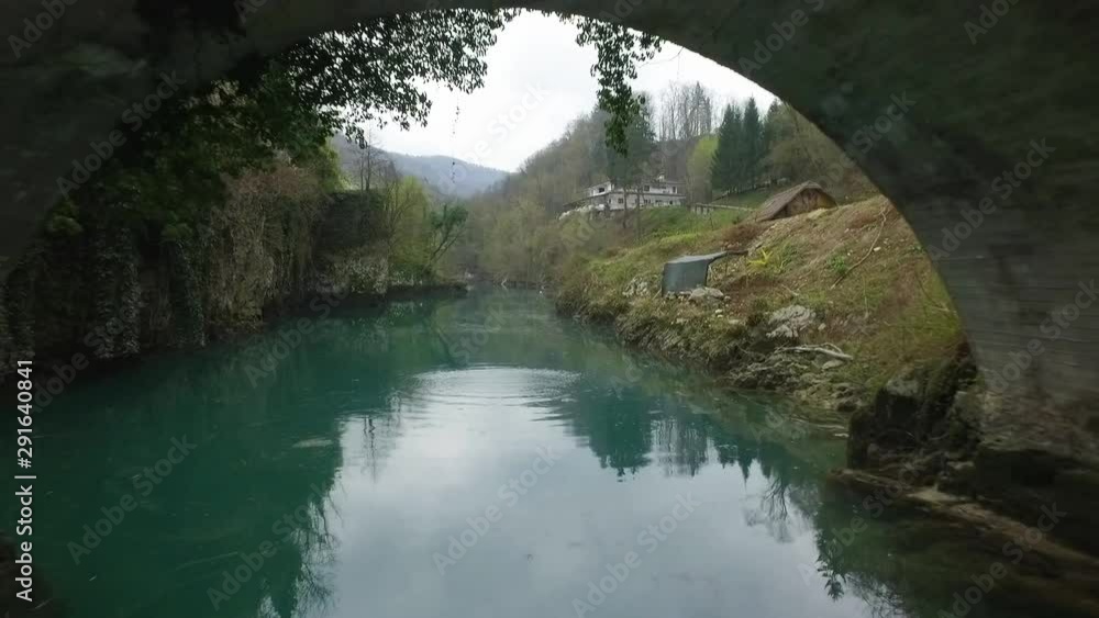 Flying under the bridge on Soca river. Slovenia Flying under the bridge on Soca river. Slovenia