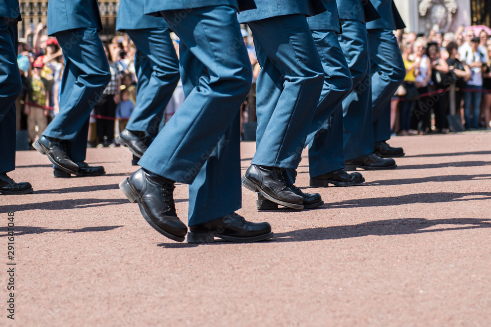 Soldiers in dress uniforms march