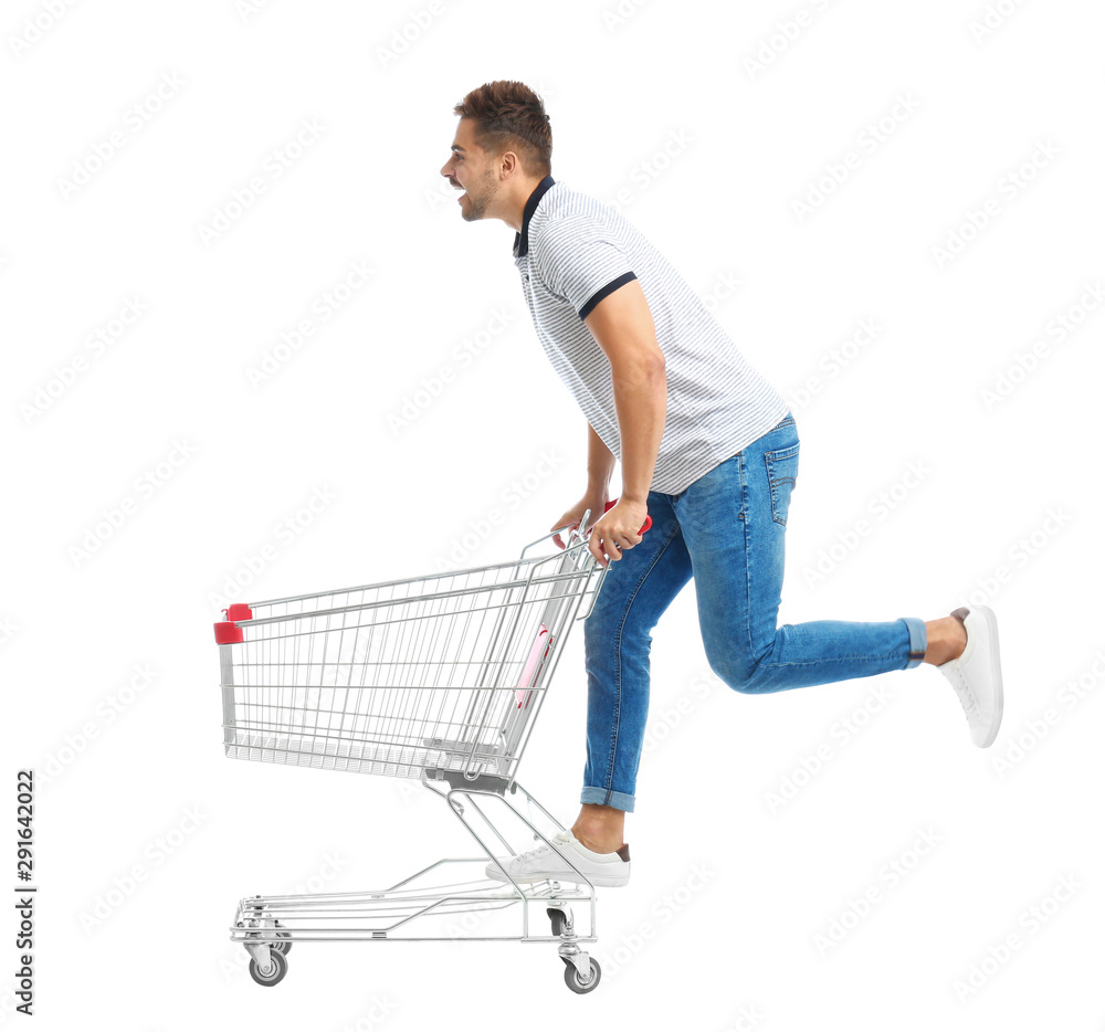 Young man with empty shopping cart on white background Young man with empty shopping cart on white background