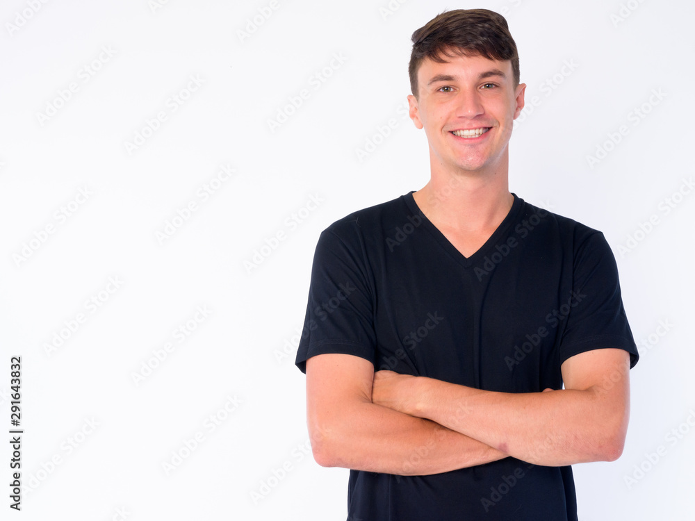 Portrait of happy young handsome man smiling with arms crossed Portrait of happy young handsome man smiling with arms crossed