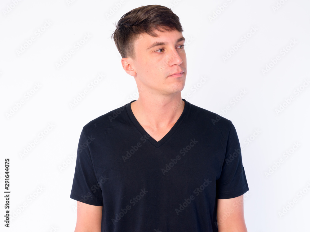 Face of young handsome man thinking and looking away Face of young handsome man thinking and looking away