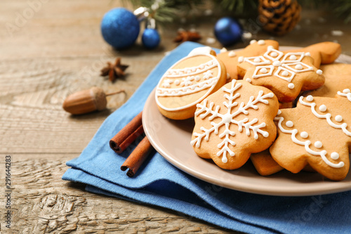 Tasty homemade Christmas cookies on wooden table, closeup