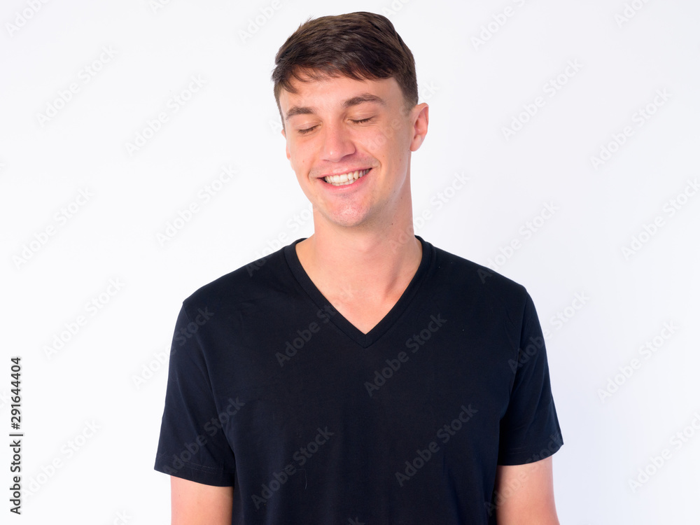Face of happy young handsome man relaxing with eyes closed Face of happy young handsome man relaxing with eyes closed